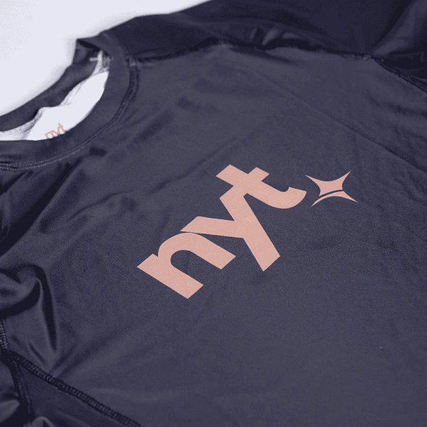 NYT Collection Short Sleeve Rashguards NYT Short Sleeve Sand Centre Logo Rashguard