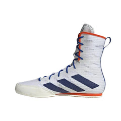 A high-top boxing shoe by Adidas, featuring a white textured mesh upper with navy blue three-stripes, blue laces, and orange accents on the collar and outsole.