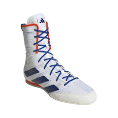 A high-top boxing shoe by Adidas, featuring a white textured upper with navy blue three-stripes, blue laces, and orange accents on the collar and outsole.