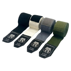 Four rolls of Pitbull Core resistance bands in black, white, gray, and green on a white background.