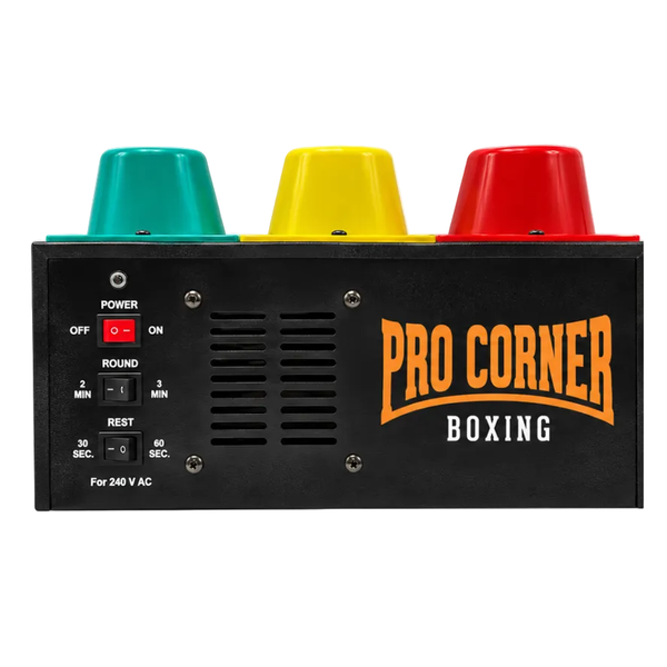 Pro Corner Boxing electronic boxing machine rear panel with three colored dials in teal, yellow, and red, a red power switch, and orange Pro Corner Boxing branding on a black faceplate.